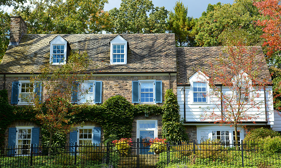 Colorworks exterior painting blue shutters on stone house